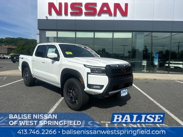 2026 Nissan Frontier PRO-4X in Glacier White — front three-quarter view