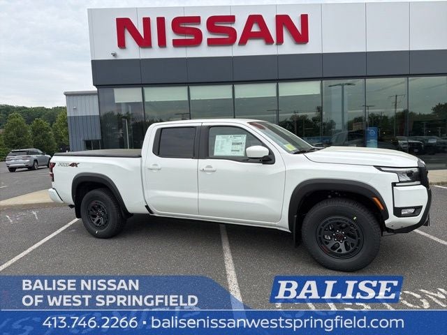 2026 Nissan Frontier PRO-4X in Glacier White — front three-quarter view