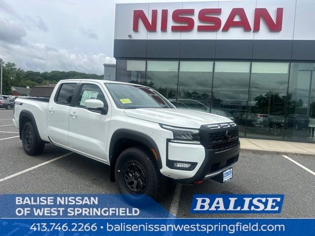 2026 Nissan Frontier PRO-4X in Glacier White — front three-quarter view