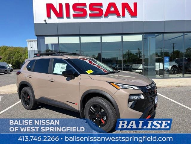 2026 Nissan Rogue Rock Creek in Baja Storm Metallic — front three-quarter view