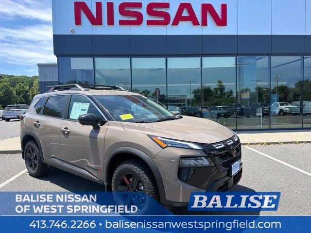 2026 Nissan Rogue Rock Creek in Baja Storm Metallic — front three-quarter view