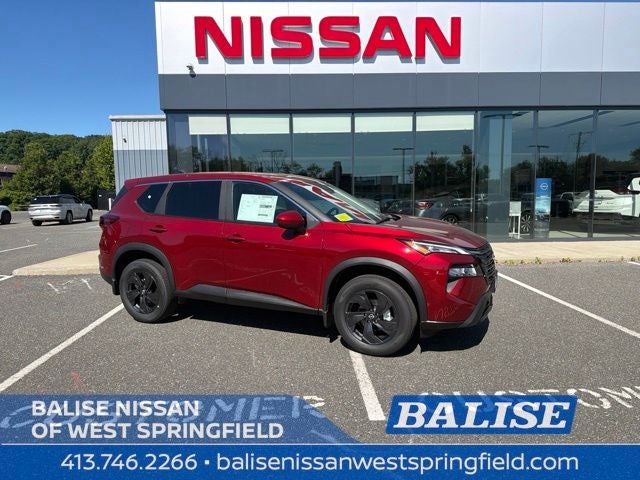 2026 Nissan Rogue SV in Scarlet Ember Tintcoat — front three-quarter view