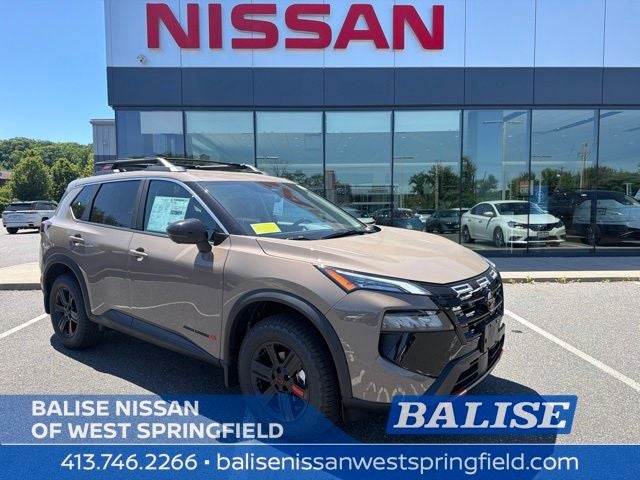 2026 Nissan Rogue Rock Creek in Baja Storm Metallic — front three-quarter view