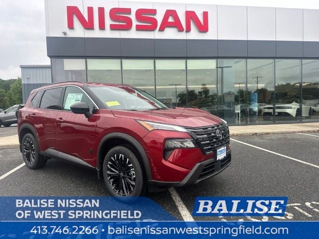 2026 Nissan Rogue Dark Armor in Scarlet Ember Tintcoat — front three-quarter view